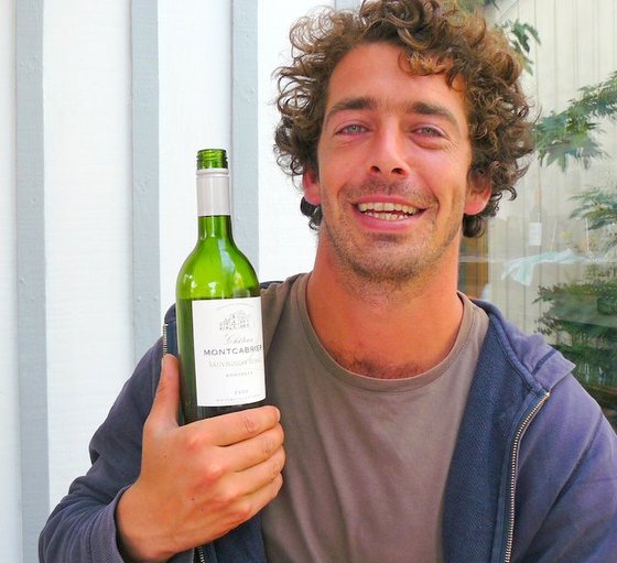 Jonathan with bottle of Montcabrier.JPG